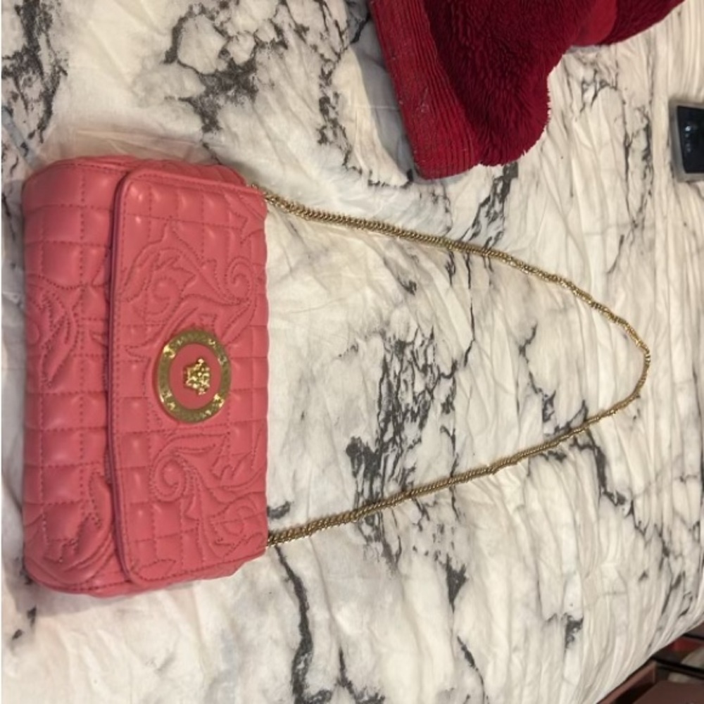 Versace Women’s Pink Leather Quilted Small Crossbody Bag. $600